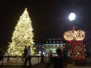 A Christmas tree shines in the night in Old Town Alexandria