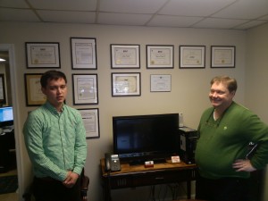 Father and son celebrate Saint Patrick's Day by wearing green at the office