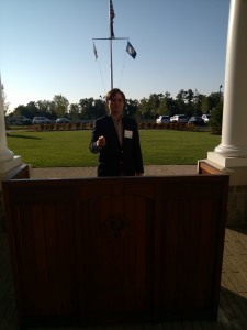 My brother Aubrey stands in front of a podium