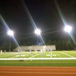 Stadium lights and maintained field with summer practice